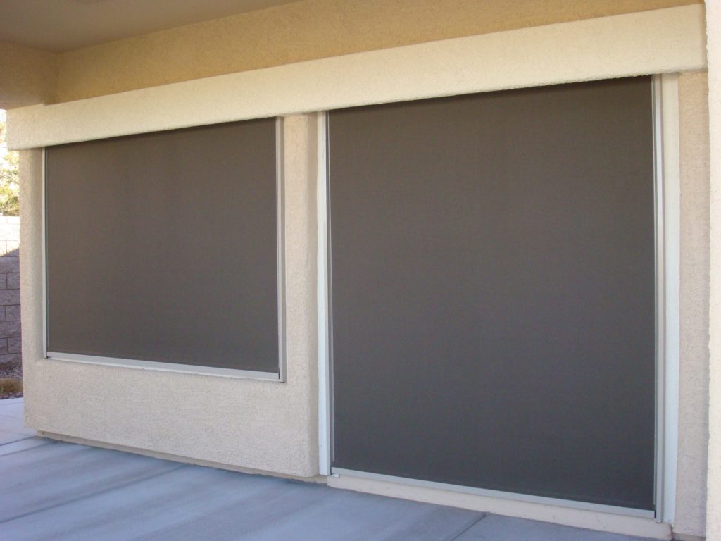 fully closed retractable cable shade covering both a french door and a window