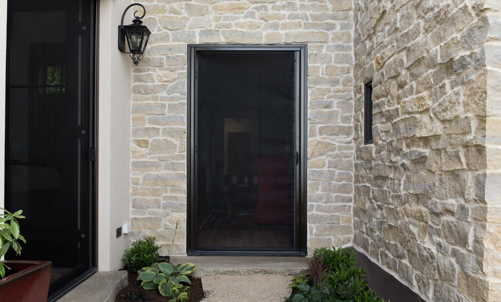 Sliding Retractable Screen Doors 4 genius retractable screen door in front of stone