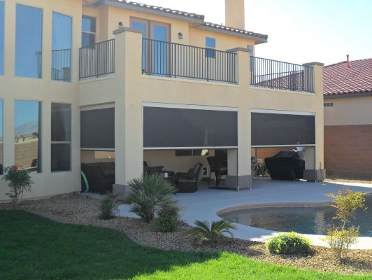 fully enclosed patio with motorized retractable sun shades